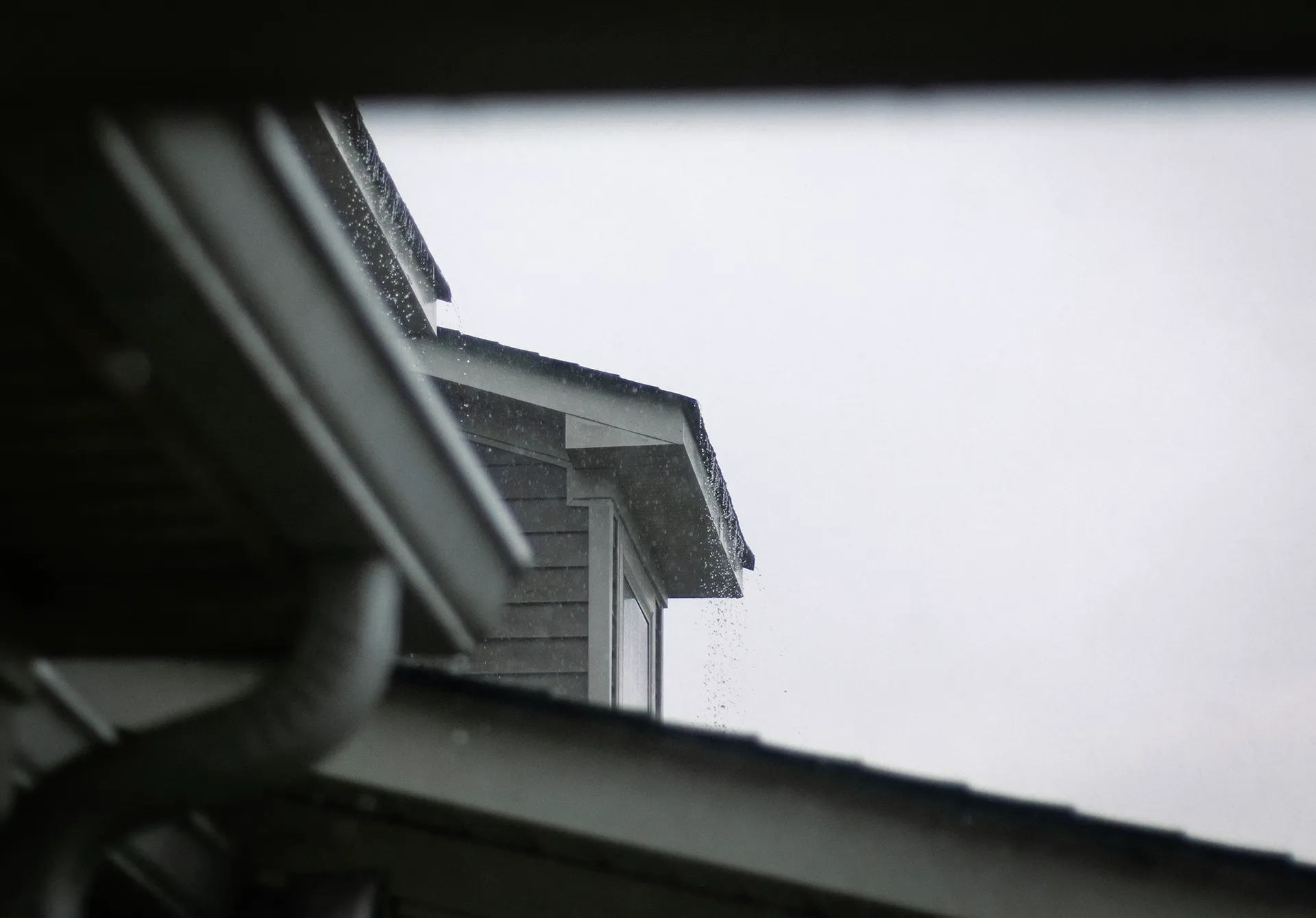 Residential roof during stormy weather